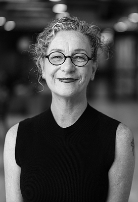 A close-up black and white portrait of AERO CEO Jenny Donovan