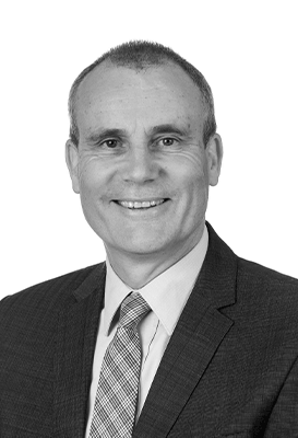 A close-up black and white portrait of Barry Sandison