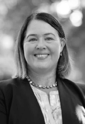 A close-up black and white portrait of Belinda Giudice