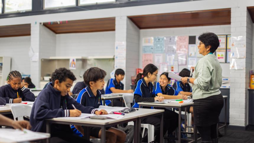 Teacher standing at the front of the class